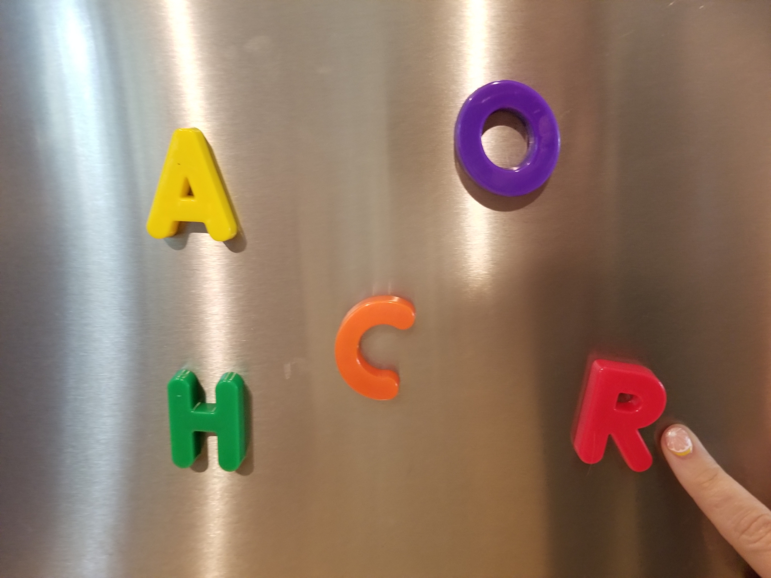 alphabet letter magnets on a fridge