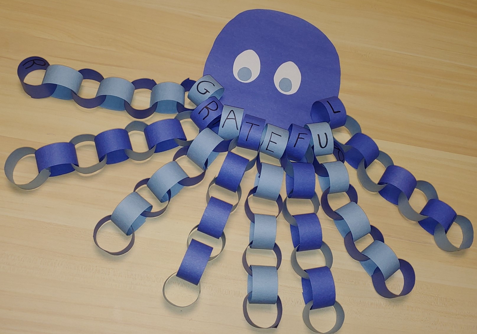 Purple octopus made from construction paper rings