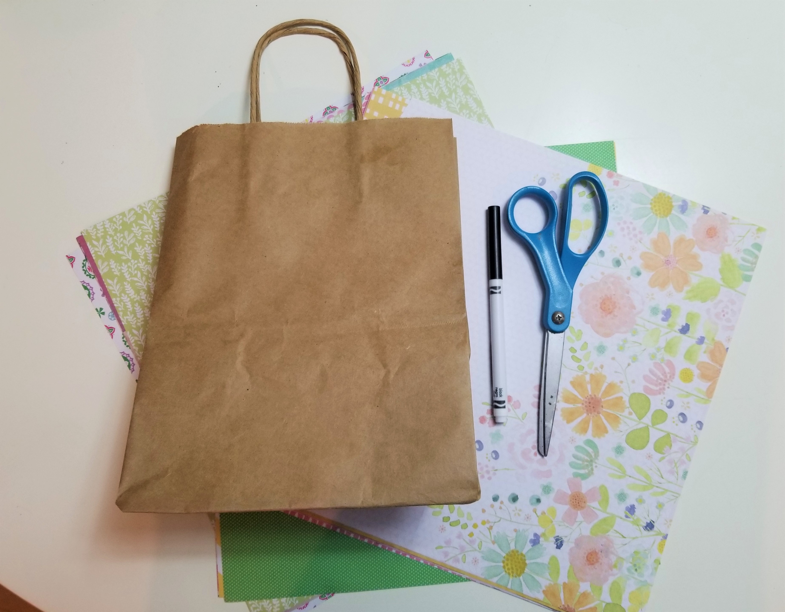 paper bag, scissors, and craft paper
