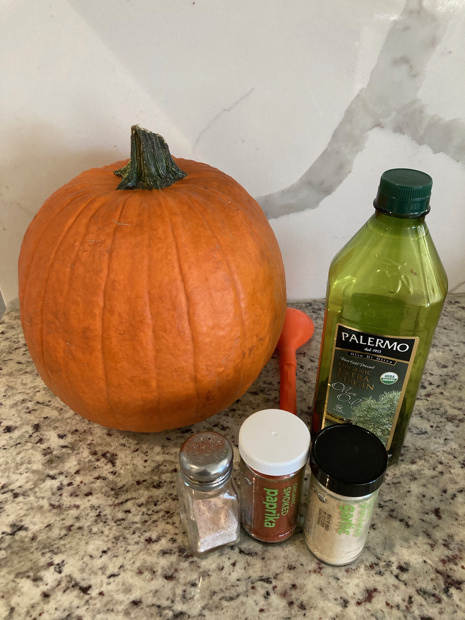 Pumpkin, oil, paprika, garlic, and salt to make Roasted Pumpkin Seeds