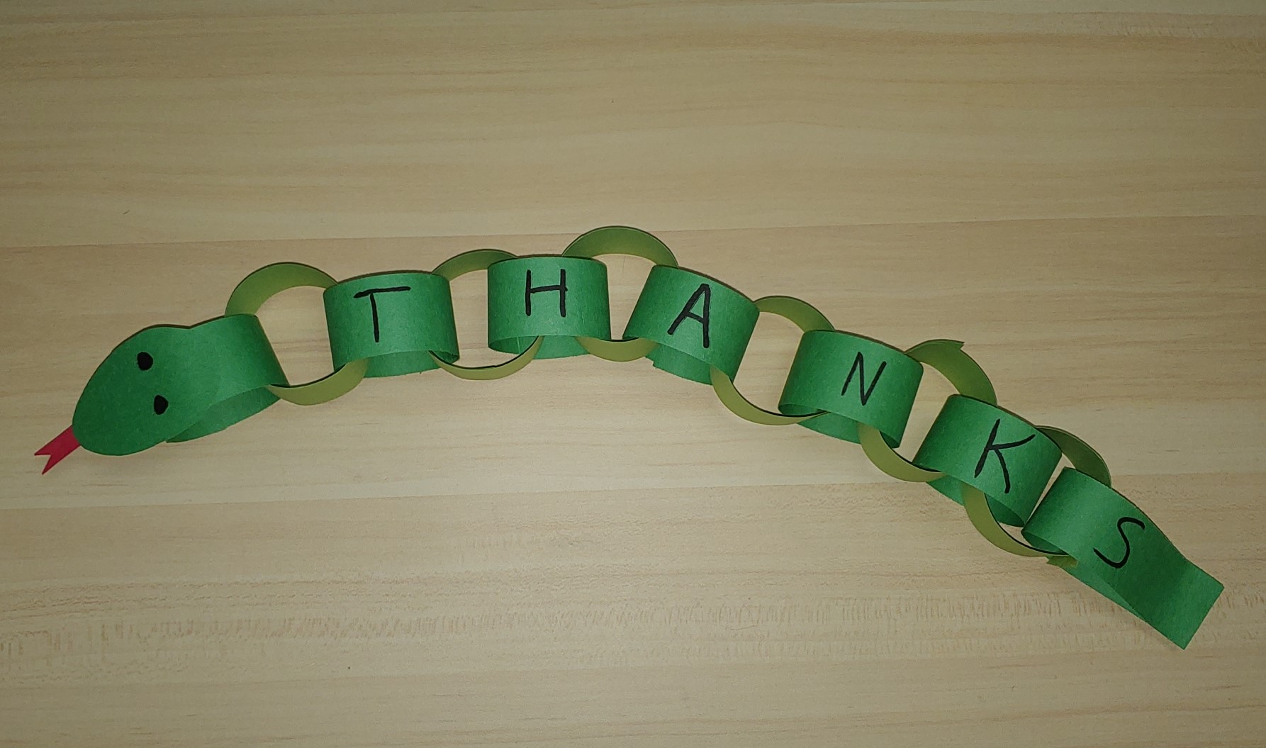 Snake made from green paper chains
