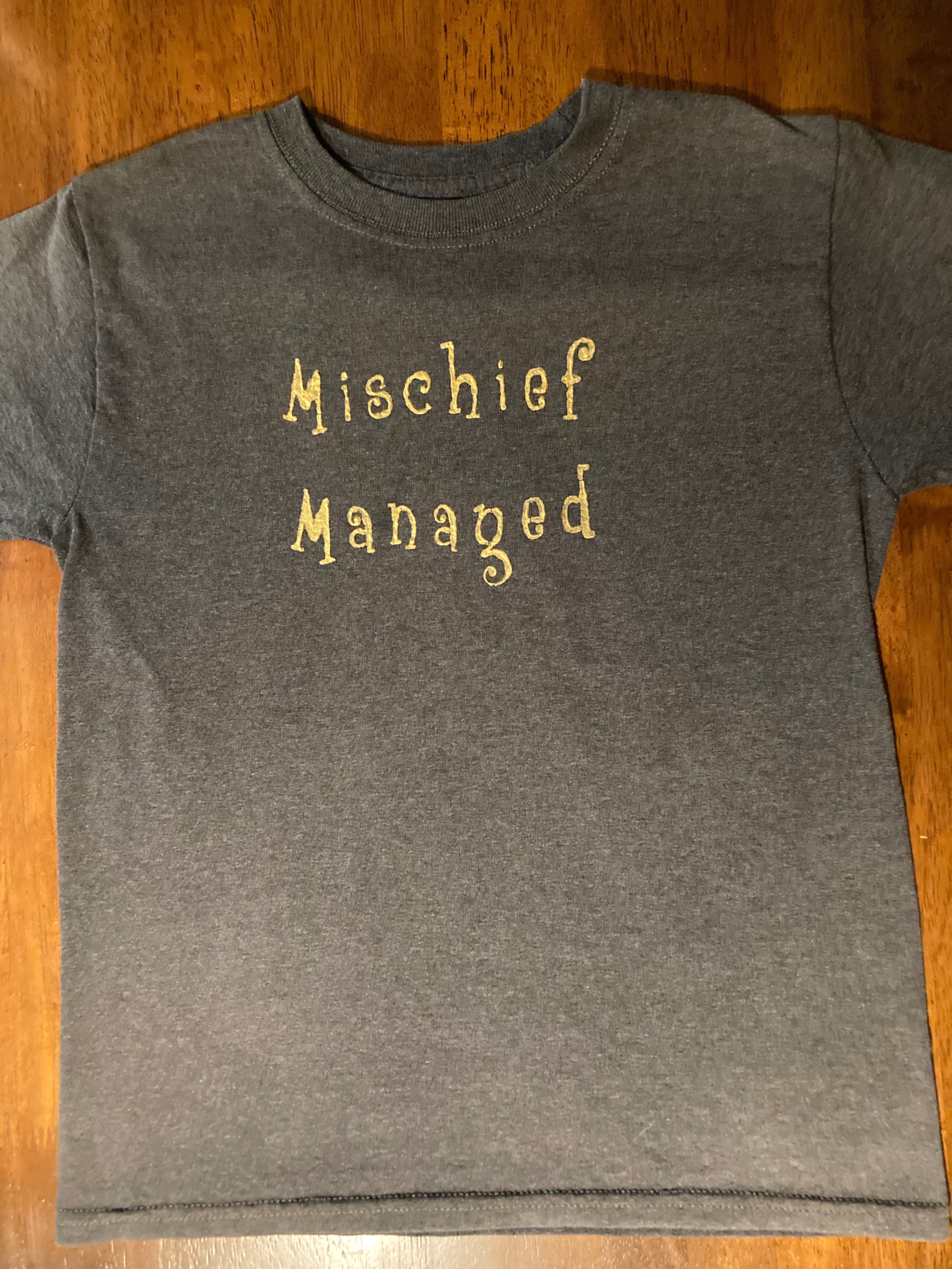 Mischief Manage written on a shirt