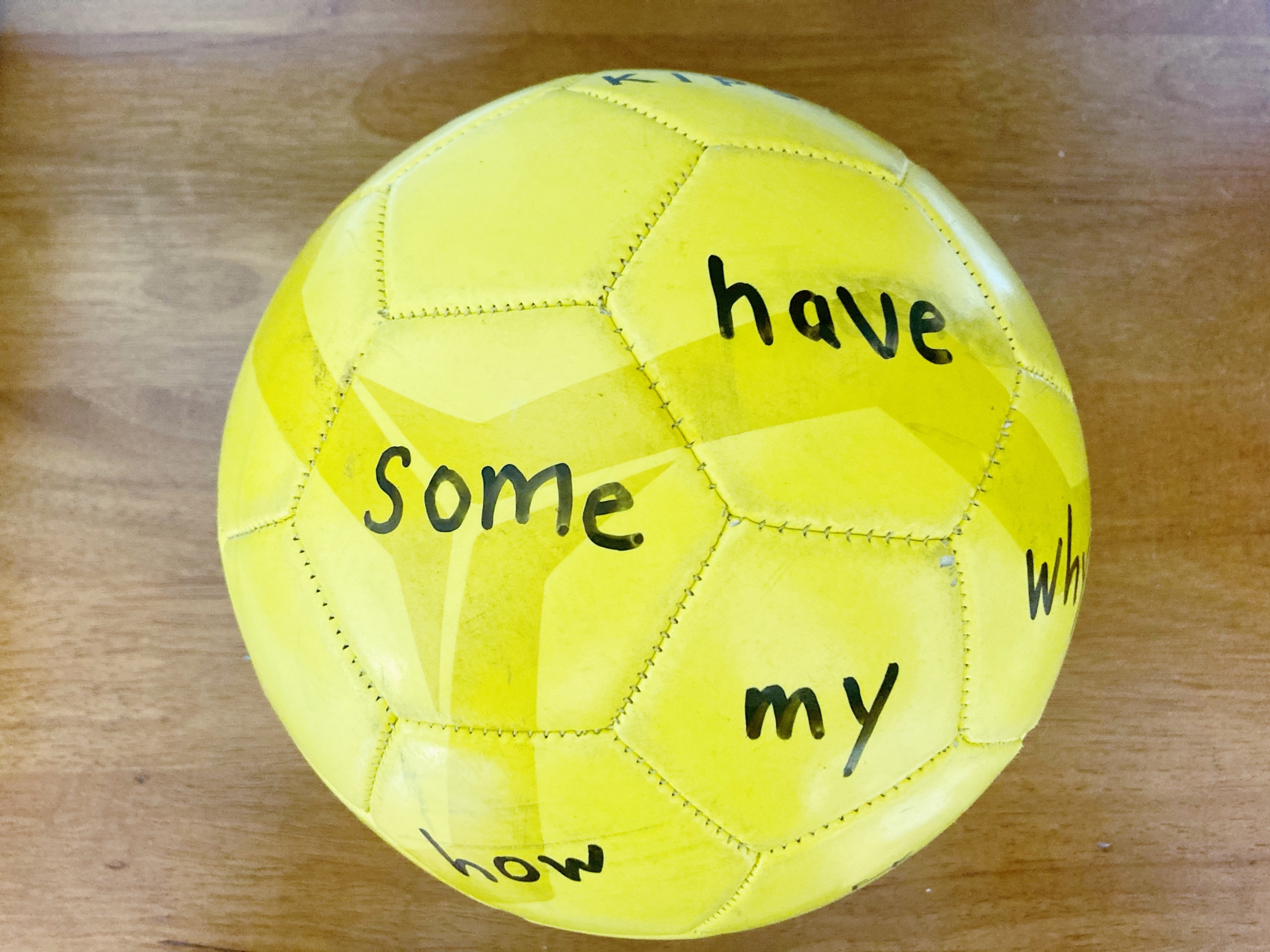 Yellow soccer ball with sight words written on it