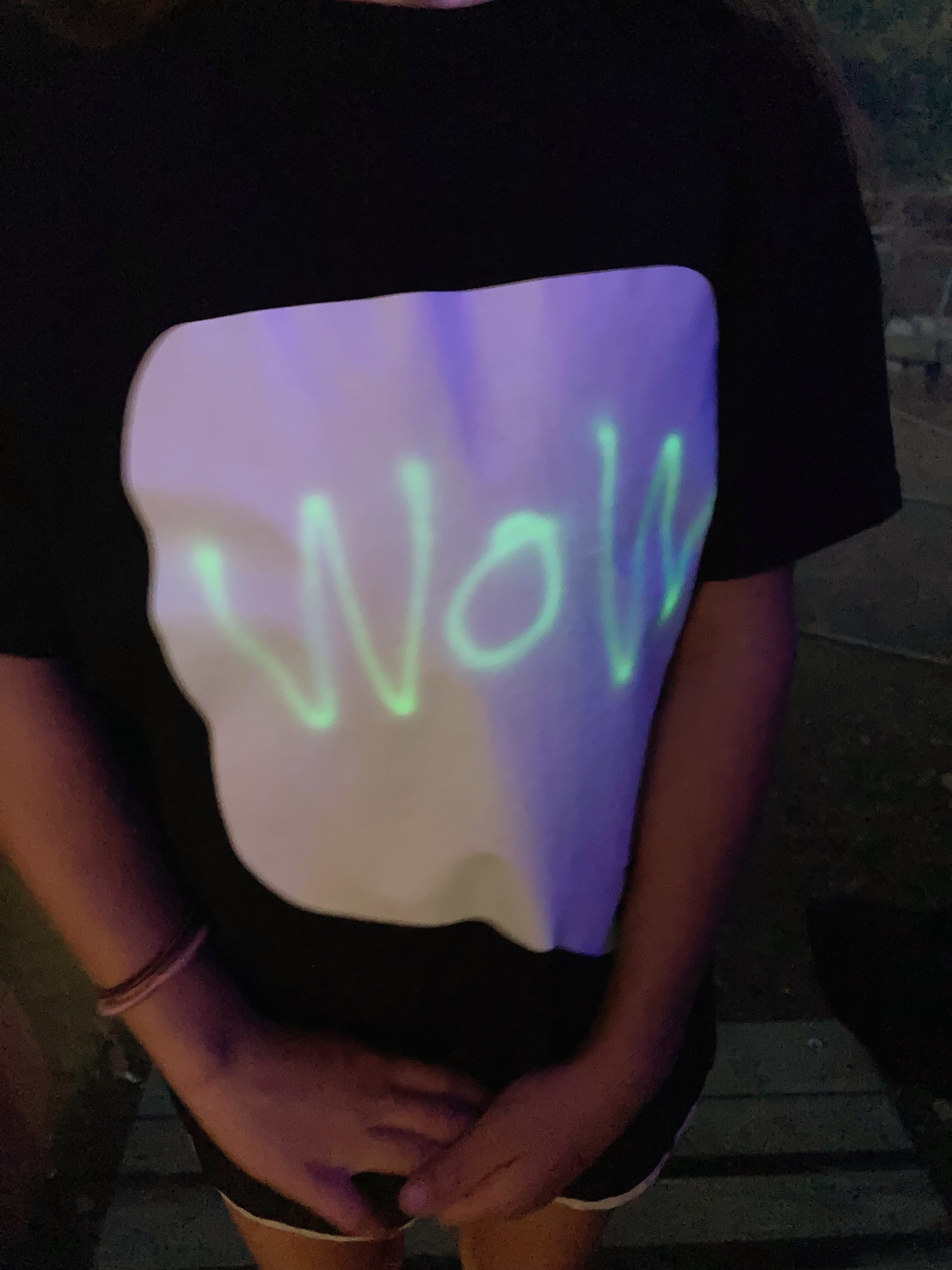 glow-in-the-dark shirt with 'Wow' written on it